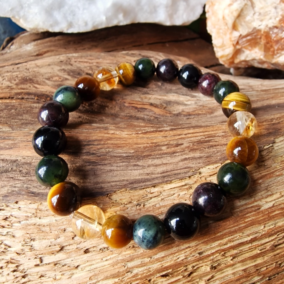 Our Prosperity bracelet combines key high-vibrational crystals to support you in boosting your strength, confidence, and creativity. The bracelet is made with high-quality crystal beads of Citrine, Tiger's Eye, Canadian Jade, Garnet, and Obsidian. 